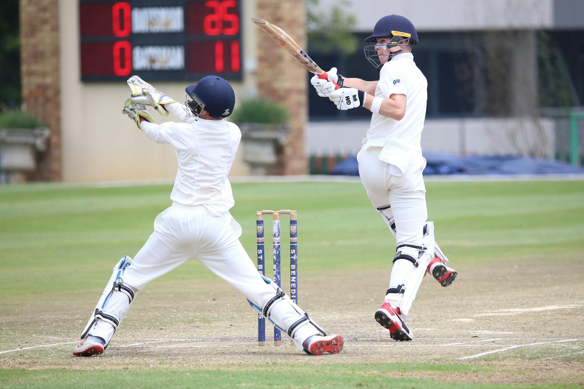 men playing cricket